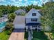 Aerial view of home with pool, lush landscaping, and a paver driveway at 2311 64Th Street W Ct, Bradenton, FL 34209