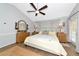 The primary bedroom is spacious with a modern ceiling fan, neutral walls, and french doors to the backyard at 2311 64Th Street W Ct, Bradenton, FL 34209