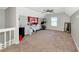 Spacious bonus room featuring carpeted floors, a ceiling fan, and ample natural light at 2311 64Th Street W Ct, Bradenton, FL 34209