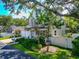 Two-story home with attached garage, covered porch, and landscaped yard at 2311 64Th Street W Ct, Bradenton, FL 34209