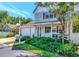Two-story home with attached garage, front porch, and manicured landscaping at 2311 64Th Street W Ct, Bradenton, FL 34209