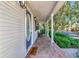 Charming front porch with brick flooring, decorative door, and welcoming landscaping at 2311 64Th Street W Ct, Bradenton, FL 34209