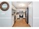 Updated kitchen with white cabinets, stainless steel appliances, modern backsplash, and wood-look flooring at 2311 64Th Street W Ct, Bradenton, FL 34209
