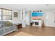 Comfortable living room with a fireplace, wood floors, and neutral decor at 2311 64Th Street W Ct, Bradenton, FL 34209