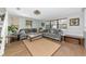 Cozy living room with hardwood floors, comfortable seating, natural light, and a welcoming atmosphere at 2311 64Th Street W Ct, Bradenton, FL 34209