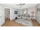 Inviting living room with neutral tones, recessed lighting, and wood flooring at 2311 64Th Street W Ct, Bradenton, FL 34209