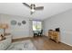 Bright living room featuring wood floors, neutral colors, and a decorative ceiling fan at 2311 64Th Street W Ct, Bradenton, FL 34209