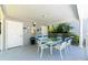 Covered outdoor patio area with seating for entertaining at 2311 64Th Street W Ct, Bradenton, FL 34209