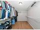 Large walk-in closet with ample adjustable shelving and clothing racks to provide plenty of storage at 2311 64Th Street W Ct, Bradenton, FL 34209