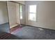 Bedroom with window, closet and flooring needing repair at 2326 Melrose S Ave, St Petersburg, FL 33712