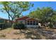 Charming single-story home featuring an enclosed porch with lots of trees providing shade at 2326 Melrose S Ave, St Petersburg, FL 33712