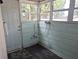 Enclosed room includes water connections, a door to the exterior and multiple windows at 2326 Melrose S Ave, St Petersburg, FL 33712