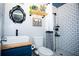 Stylish bathroom featuring a tiled shower, modern fixtures, and unique decor at 2403 E Osborne Ave, Tampa, FL 33610