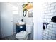 Stylish bathroom features modern fixtures, updated vanity, and decorative tile flooring at 2403 E Osborne Ave, Tampa, FL 33610
