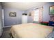 Comfortable bedroom features a window with curtains for natural light and ample space at 2403 E Osborne Ave, Tampa, FL 33610