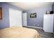 Spacious bedroom with hardwood flooring, walk-in closet, and plenty of natural light at 2403 E Osborne Ave, Tampa, FL 33610