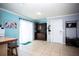 Open dining room with tile floors, sliding glass doors, and plenty of natural light at 2403 E Osborne Ave, Tampa, FL 33610