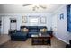 Spacious living room featuring a sectional sofa and modern decor at 2403 E Osborne Ave, Tampa, FL 33610