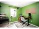 Functional office space with a desk, chair, and shelving for efficient work or study at 2403 E Osborne Ave, Tampa, FL 33610