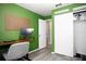 Functional office space with a desk, chair, and shelving for efficient work or study at 2403 E Osborne Ave, Tampa, FL 33610