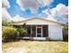 Lovely screened porch with plants, perfect for enjoying the outdoors at 2403 E Osborne Ave, Tampa, FL 33610
