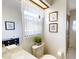 Compact bathroom featuring a vanity, mirror, framed art, and modern fixtures at 2517 Bucknell Dr, Valrico, FL 33596