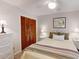 Bright and cheery bedroom with a closet, white dresser, bed, and white ceiling fan at 2517 Bucknell Dr, Valrico, FL 33596