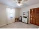 Cozy bedroom with a ceiling fan, closet, and natural light filtering through the curtains at 2517 Bucknell Dr, Valrico, FL 33596