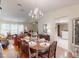 Formal dining room with a chandelier, hardwood floors, and elegant furniture at 2517 Bucknell Dr, Valrico, FL 33596