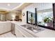 Bright kitchen featuring a double sink with a window and stainless steel dishwasher at 2517 Bucknell Dr, Valrico, FL 33596