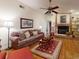 Inviting living room showcasing a fireplace, hardwood floors, and comfortable seating at 2517 Bucknell Dr, Valrico, FL 33596