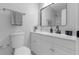 Updated bathroom with a modern vanity, marble countertop, and a framed mirror at 2613 E 113Th Ave, Tampa, FL 33612