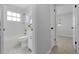 Bright bathroom features a tub with shower, white vanity, and neutral paint at 2613 E 113Th Ave, Tampa, FL 33612