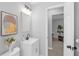 This bathroom offers a modern vanity, decorative accents, and neutral paint at 2613 E 113Th Ave, Tampa, FL 33612