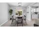 Charming dining area with natural lighting and views of backyard at 2613 E 113Th Ave, Tampa, FL 33612