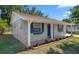 Beautiful house featuring lush lawn, attached garage, landscaping, and a freshly painted facade at 2613 E 113Th Ave, Tampa, FL 33612