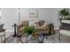 Stylish living area with modern furnishings, a decorative rug, and natural accents at 2613 E 113Th Ave, Tampa, FL 33612