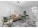 Bright living room featuring contemporary decor, stylish furniture, and ample natural light at 2613 E 113Th Ave, Tampa, FL 33612