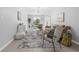 Open concept living space featuring stylish furniture, natural accents, and neutral tones at 2613 E 113Th Ave, Tampa, FL 33612