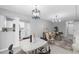Bright open living space featuring tiled floors that connect the kitchen and living areas at 2613 E 113Th Ave, Tampa, FL 33612