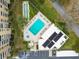 Aerial shot of pool and shuffleboard near the condominium building at 2620 Cove Cay Dr # 704, Clearwater, FL 33760