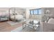 Bright, stylish bedroom featuring a modern canopy bed, sleek furniture, and floor-to-ceiling windows with a view at 2620 Cove Cay Dr # 704, Clearwater, FL 33760