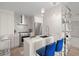 Modern kitchen with stainless steel appliances, stylish tile backsplash, and a sleek island with seating at 2620 Cove Cay Dr # 704, Clearwater, FL 33760