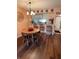 Charming dining area with wood floors and view into the kitchen at 2625 State Road 590 # 913, Clearwater, FL 33759