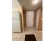 Inviting entryway with neutral tile flooring, closet, and white appliances create a bright arrival at 2625 State Road 590 # 913, Clearwater, FL 33759