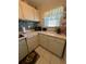Bright kitchen featuring stylish backsplash, modern appliances, and ample counter space at 2625 State Road 590 # 913, Clearwater, FL 33759