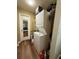 Small laundry closet with stacked washer and dryer and storage at 2625 State Road 590 # 913, Clearwater, FL 33759