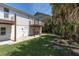 Rear exterior view of the home, showcasing wooden balconies overlooking the backyard at 2807 57Th S St, Gulfport, FL 33707