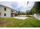 Exterior of the home overlooking private backyard pool and wooden balconies above at 2807 57Th S St, Gulfport, FL 33707