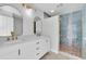 Stylish bathroom featuring double sinks, modern vanity, and a luxurious walk-in shower with a unique tile design at 2807 57Th S St, Gulfport, FL 33707